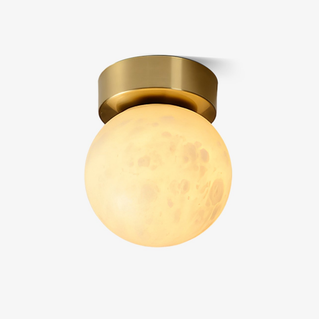 Elegant alabaster brass ceiling lamp, warm ambient light, celestial glow, sophisticated brass detailing, modern design.