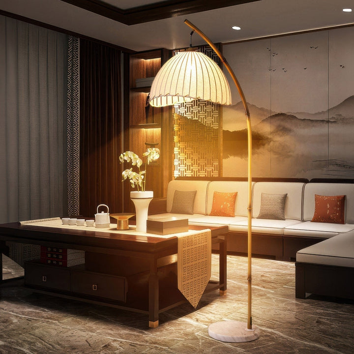 Elegant bamboo floor lamp with fabric shade, offering ambient lighting for a relaxing ambiance in home decor settings.