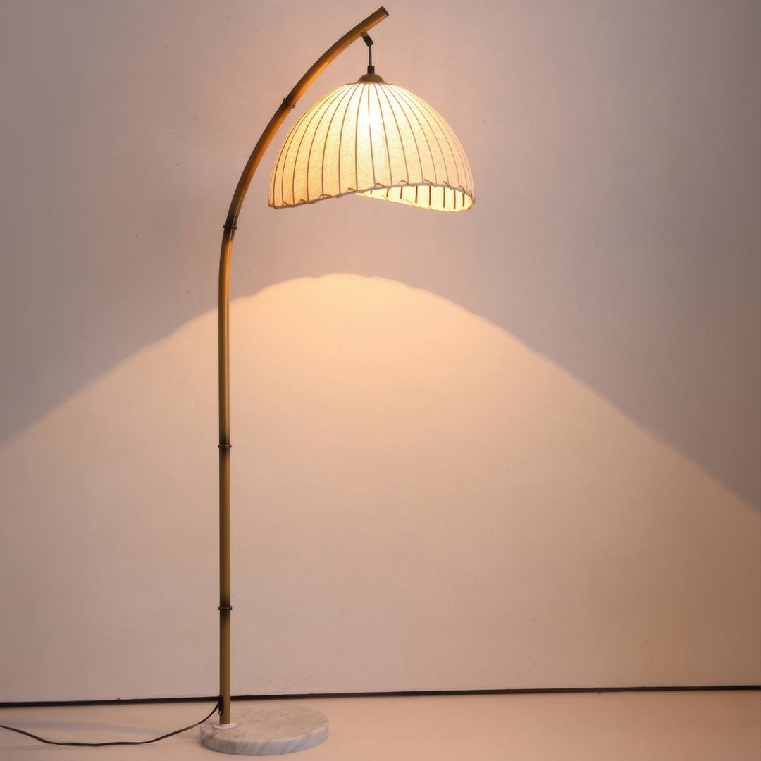 Elegant bamboo floor lamp with fabric shade, offering ambient lighting for a relaxing ambiance in home decor settings.