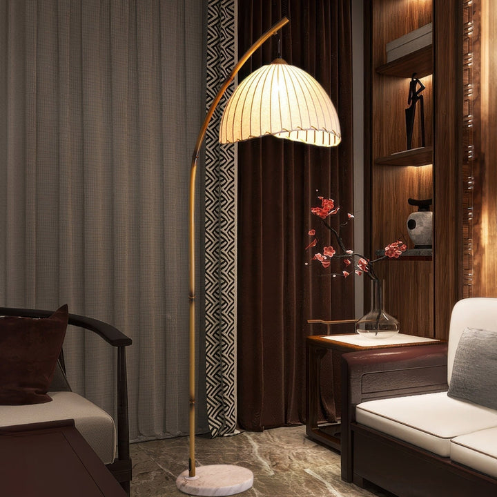 Elegant bamboo floor lamp with fabric shade, offering ambient lighting for a relaxing ambiance in home decor settings.