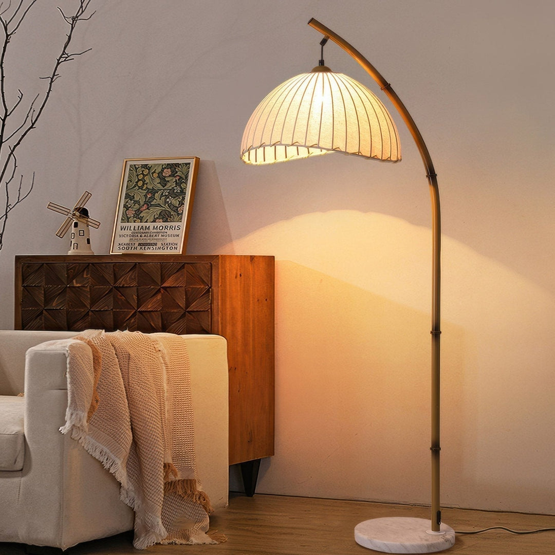 Elegant bamboo floor lamp with fabric shade, offering ambient lighting for a relaxing ambiance in home decor settings.