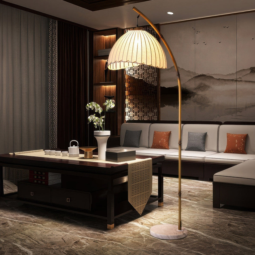 Elegant bamboo floor lamp with fabric shade, offering ambient lighting for a relaxing ambiance in home decor settings.