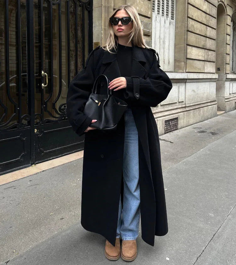 Women's chic double-breasted longline coat in black, a classic & elegant piece for any wardrobe.