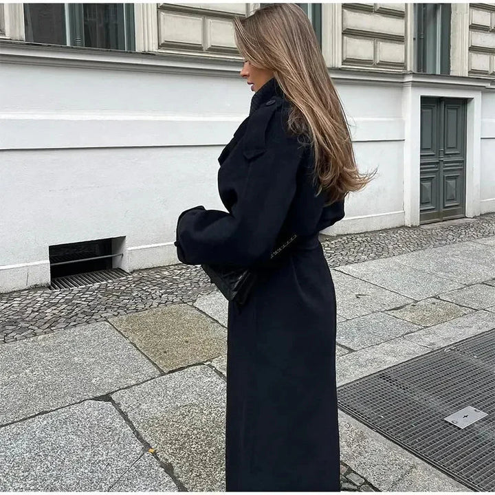 Women's elegant black longline coat, featuring a double-breasted front for a sophisticated outerwear style.