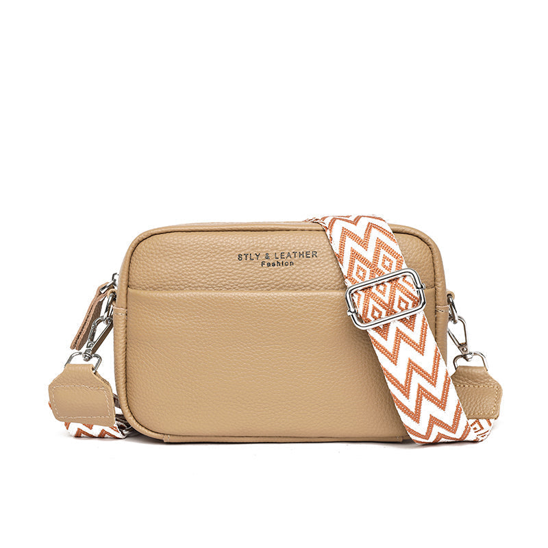 Khaki elegant leather crossbody handbag, a chic fashion accessory for women with a spacious design.