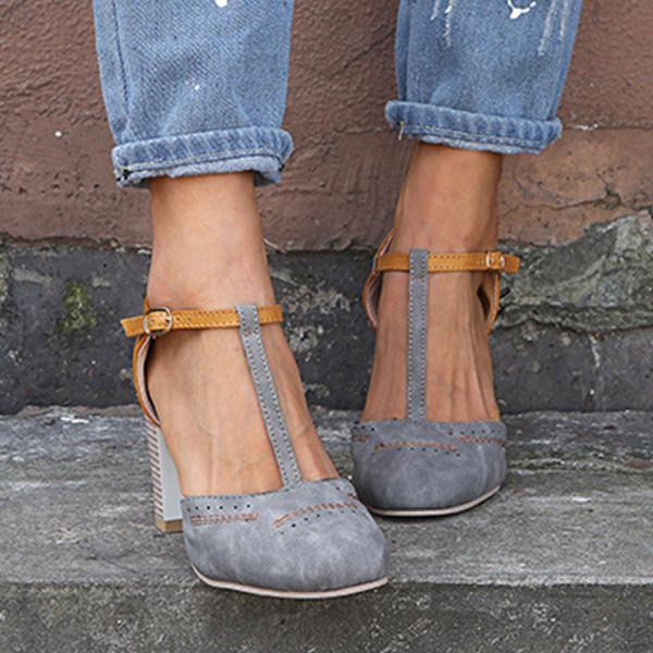 Close-up of a women's T-strap block heel showing intricate strap detail and stable block heel design.