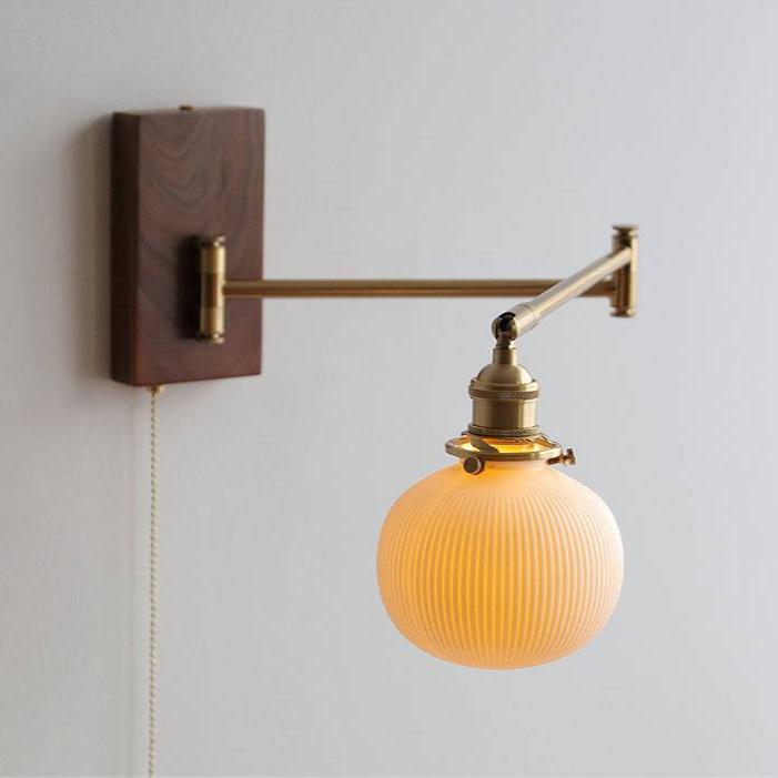 "Elegant ceramic wall lamp with wooden plate, featuring a modern design in cylinder or globe lampshade for stylish interiors.