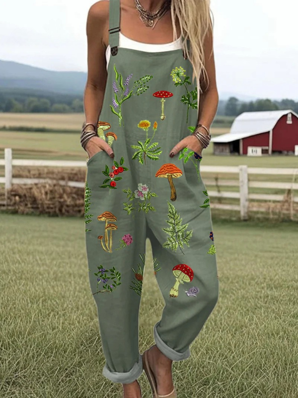 Elegant dark green women's jumpsuit with nature-inspired floral embroidery. Comfortable and chic dungarees.