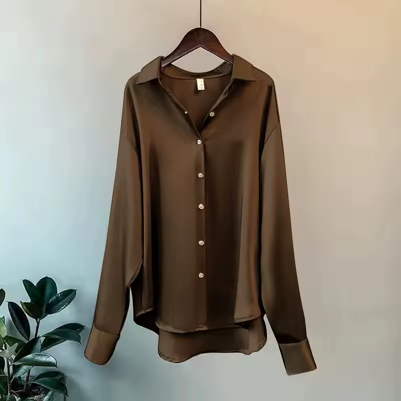 Modern elegant women's flowy blouse, a chic long sleeve collared top for sophisticated and refined style.