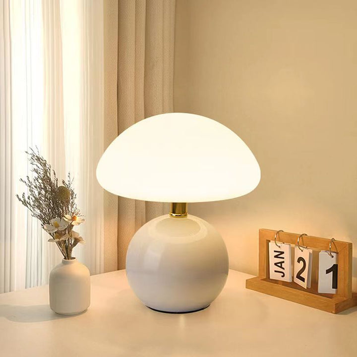 "Elegant French cream mushroom table lamp with adjustable LED colors, inspired by whimsical design and Bauhaus style."