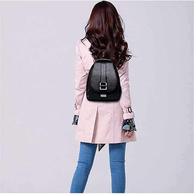 Close-up of water-resistant genuine leather texture on women's stylish backpack.