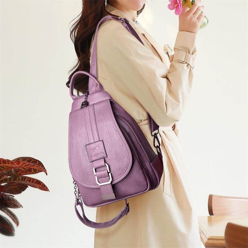 Women's premium anti-theft leather backpack, water-resistant, side view.