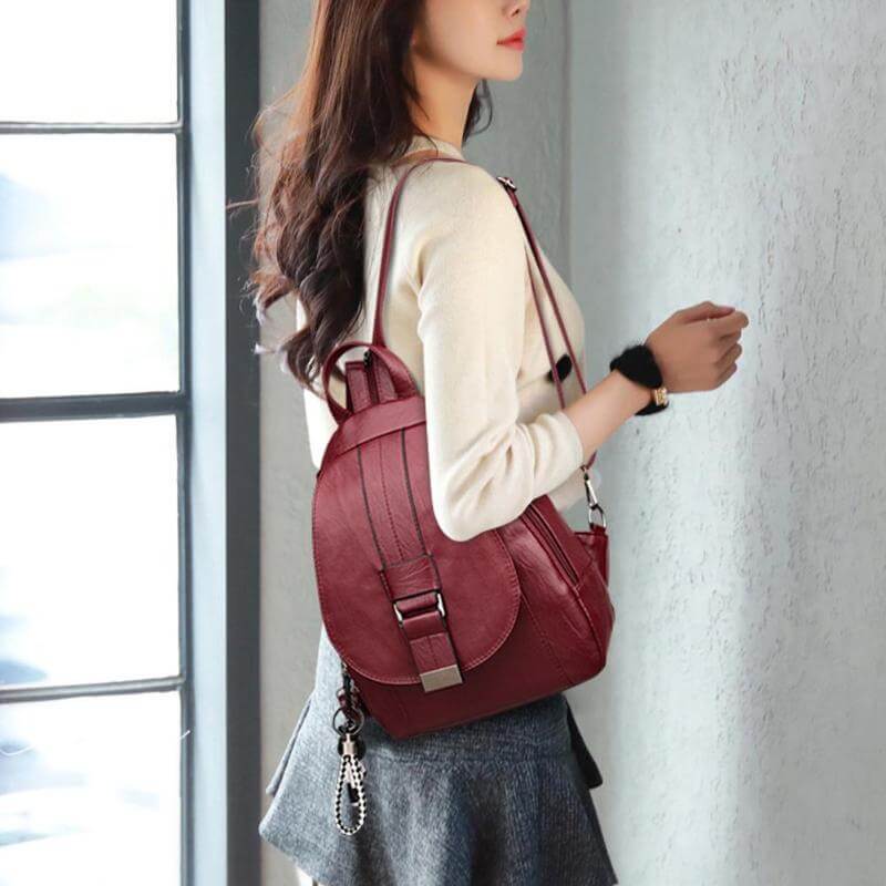 Front pocket detail on elegant water-resistant women's leather backpack.