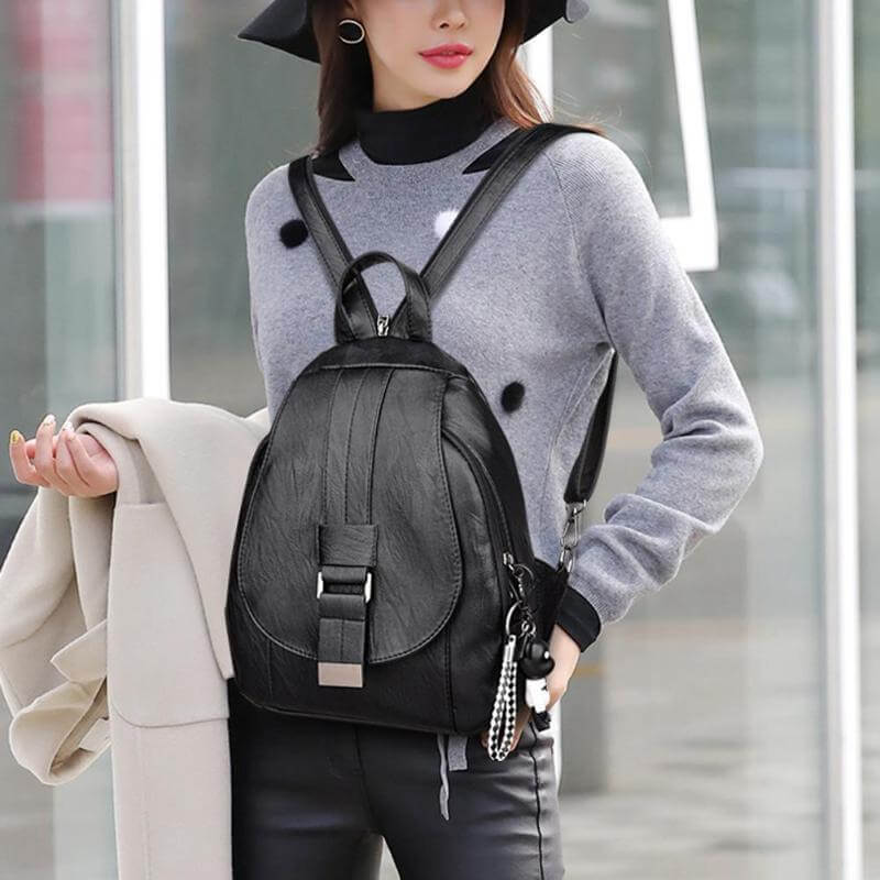 Women's versatile genuine leather travel backpack, water-resistant, premium design.