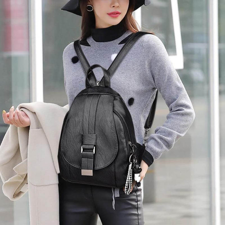 Women's versatile genuine leather travel backpack, water-resistant, premium design.