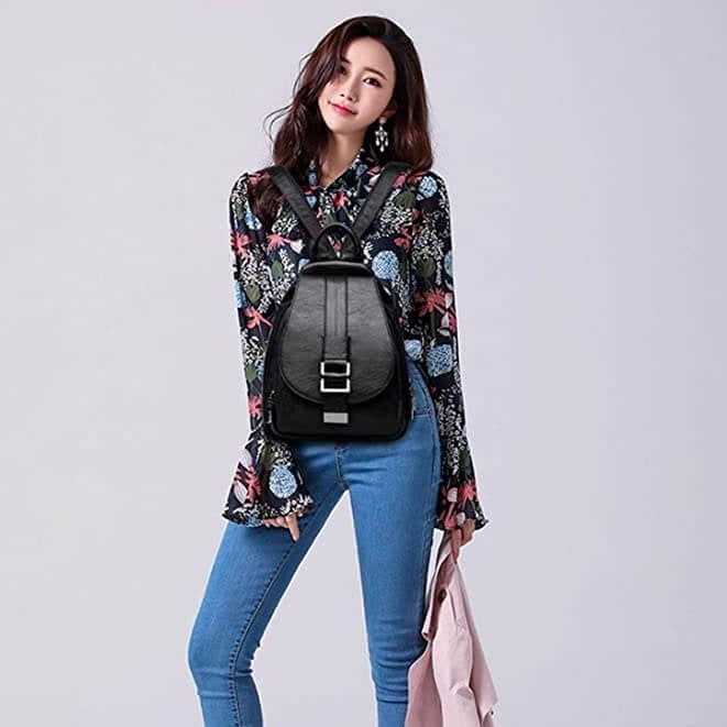 Genuine leather water-resistant backpack for women, sophisticated & travel-ready.