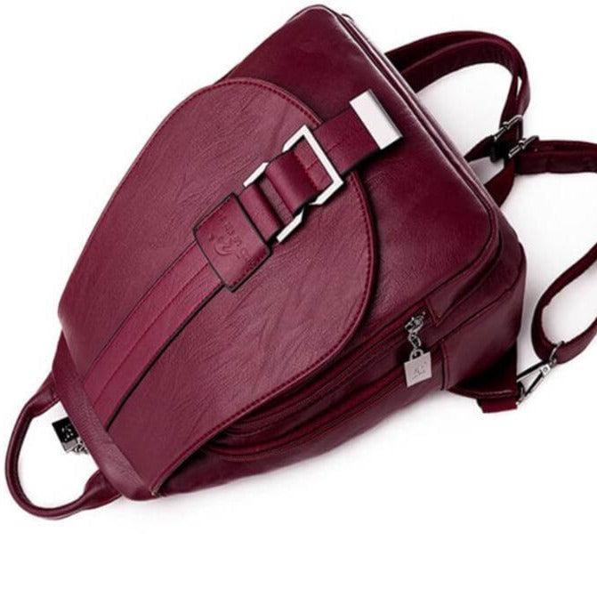 Stylish women's sheepskin leather backpack, water-resistant, showing zipper details.