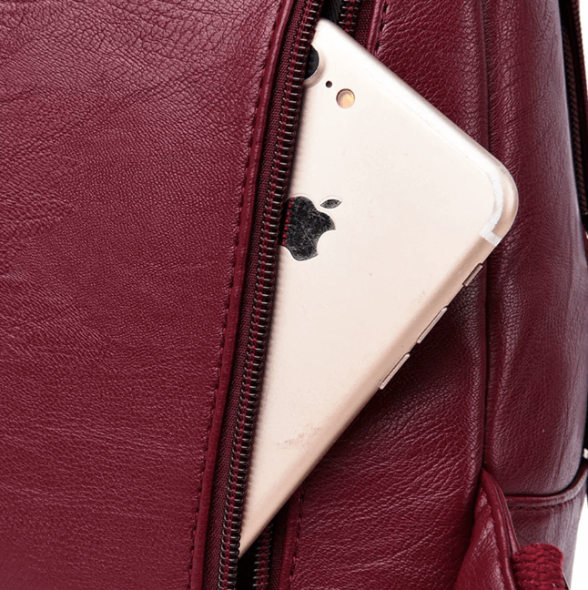 Versatile genuine leather backpack for women, water-resistant, premium travel bag.