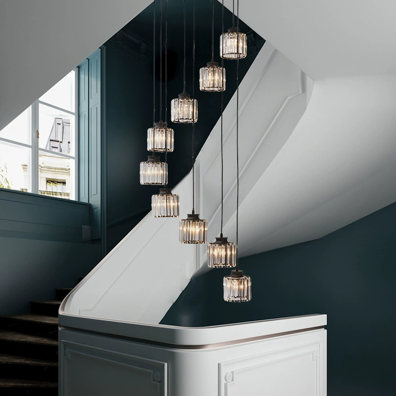 "Elegant gold and black crystal chandelier with cascading crystals, perfect for staircases and grand entryways, luxurious lig