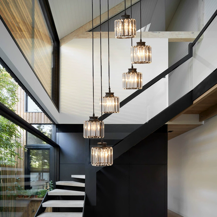 "Elegant gold and black crystal chandelier with cascading crystals, perfect for staircases and grand entryways, luxurious lig