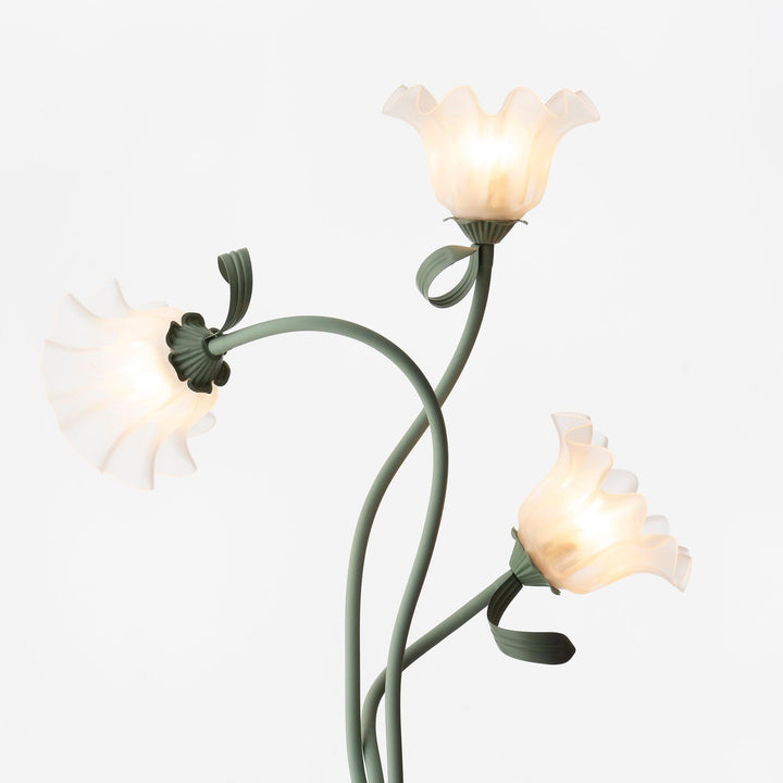Elegant green floor lamp with white calla flower accents, matte finish, and metal construction, enhancing home decor.