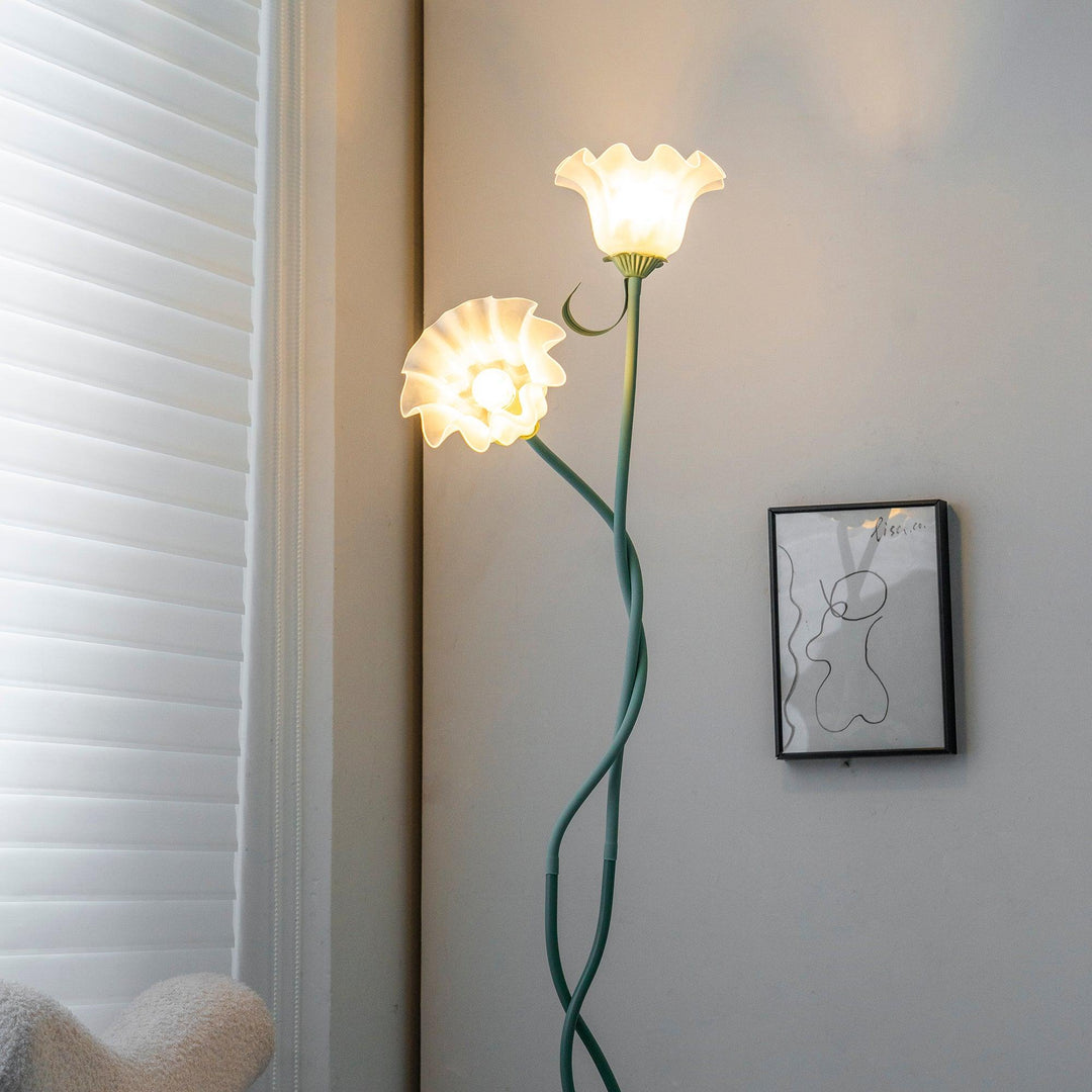 Elegant green floor lamp with white calla flower accents, matte finish, and metal construction, enhancing home decor.