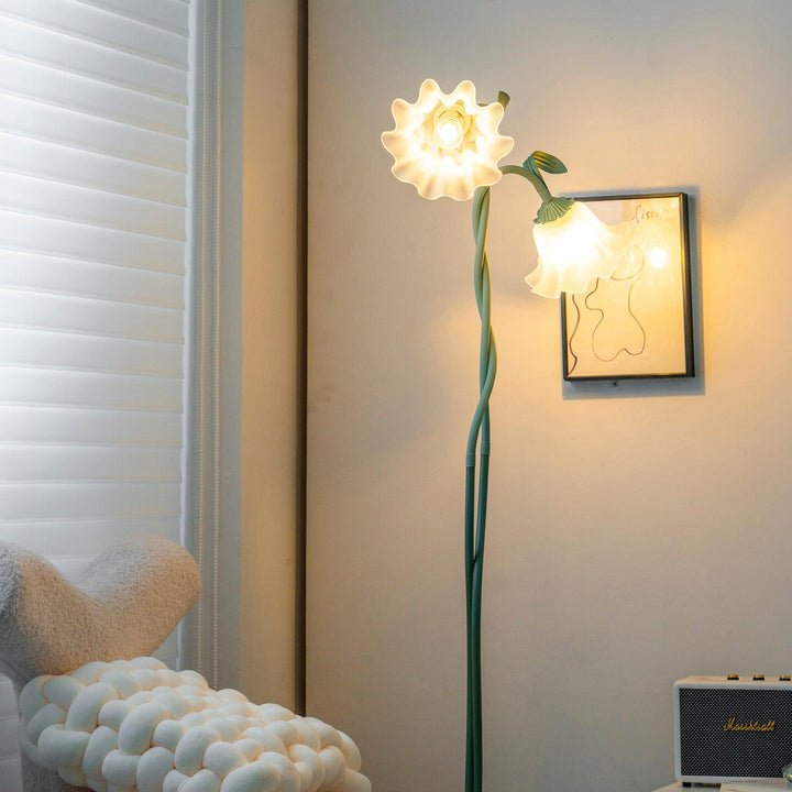 Elegant green floor lamp with white calla flower accents, matte finish, and metal construction, enhancing home decor.