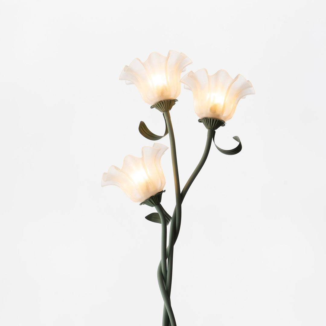 Elegant green floor lamp with white calla flower accents, matte finish, and metal construction, enhancing home decor.