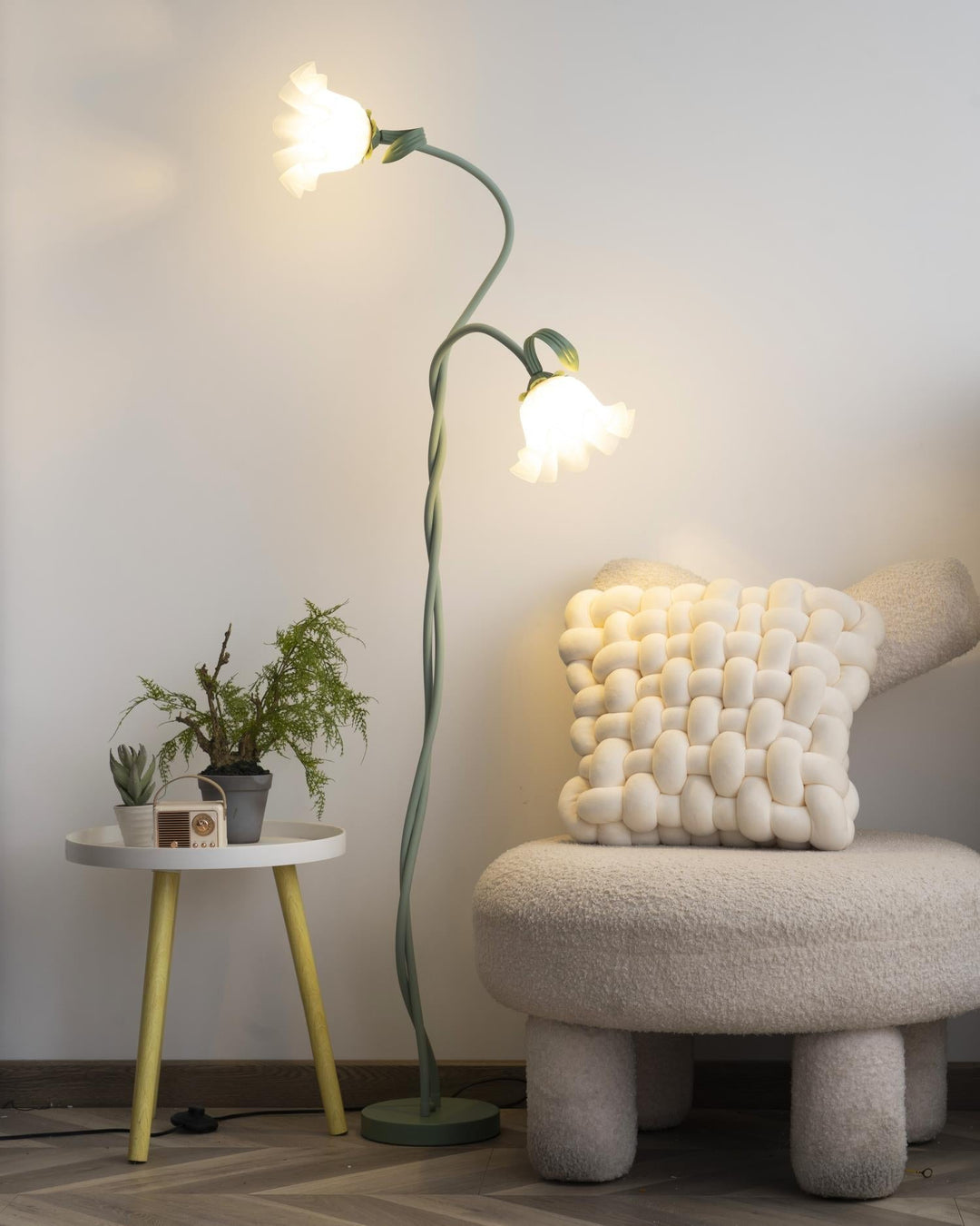 Elegant green floor lamp with white calla flower accents, matte finish, and metal construction, enhancing home decor.