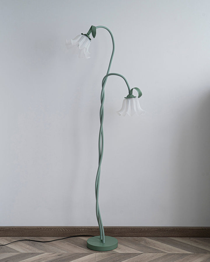 Elegant green floor lamp with white calla flower accents, matte finish, and metal construction, enhancing home decor.