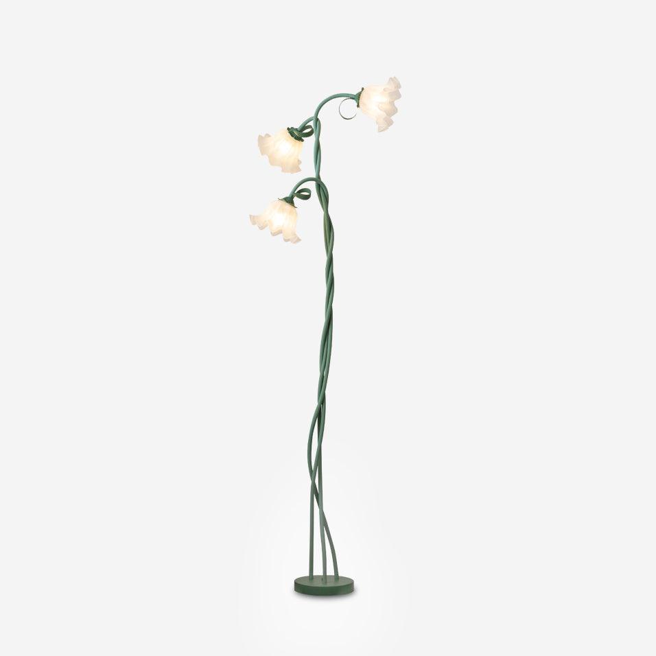Elegant green floor lamp with white calla flower accents, matte finish, and metal construction, enhancing home decor.