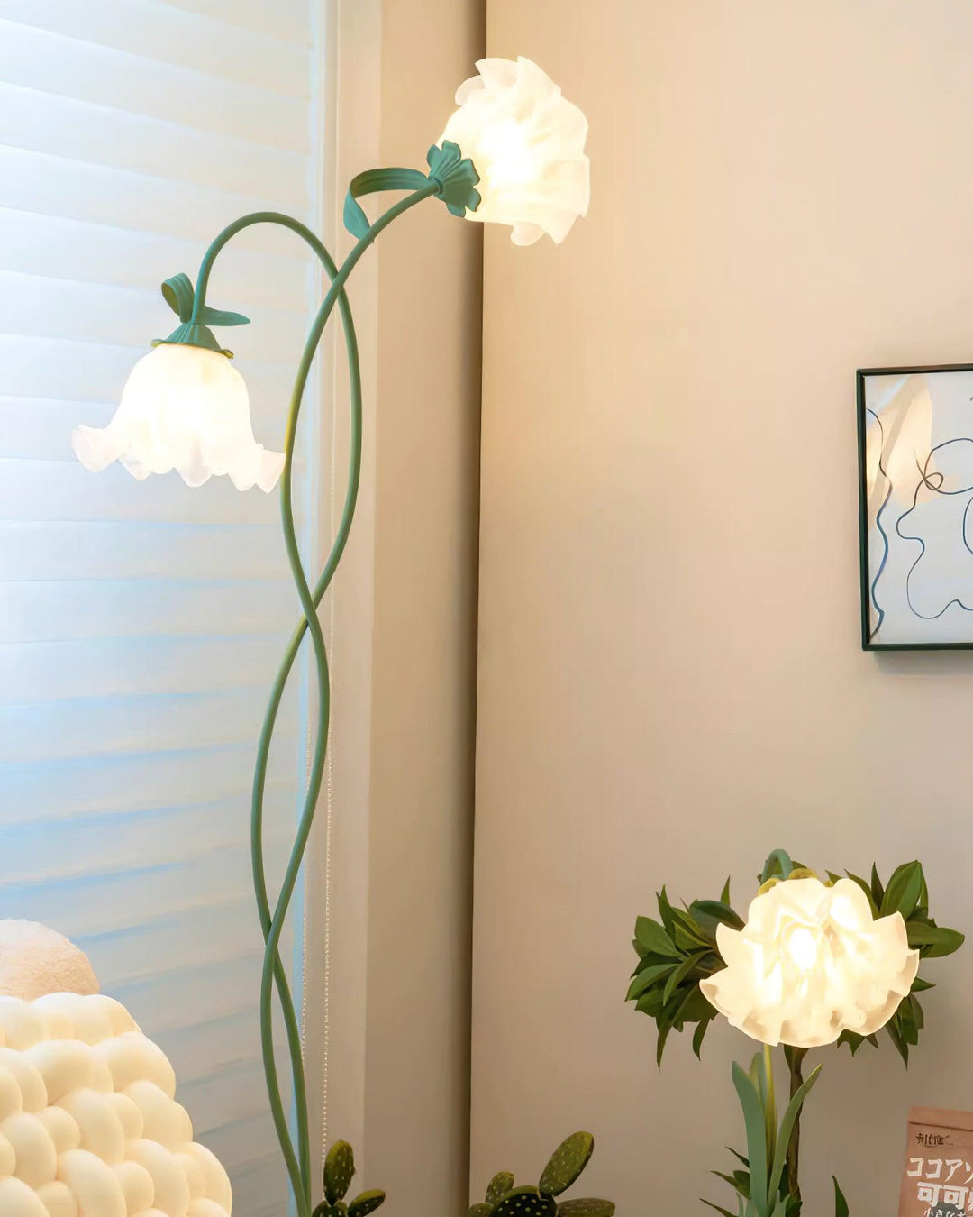 Elegant green floor lamp with white calla flower accents, matte finish, and metal construction, enhancing home decor.