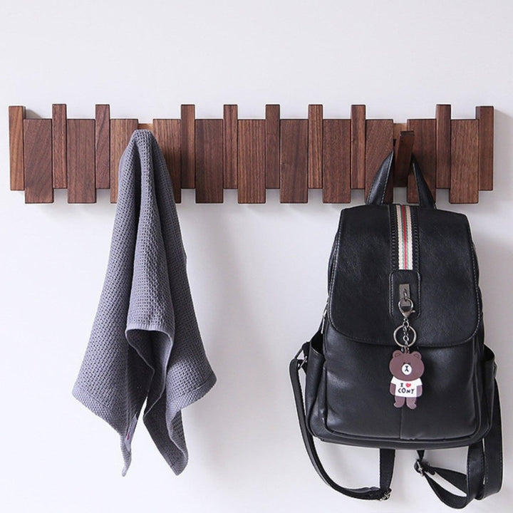 "Elegant handmade wooden piano coatrack front view, showcasing unique piano key design and quality craftsmanship in home deco