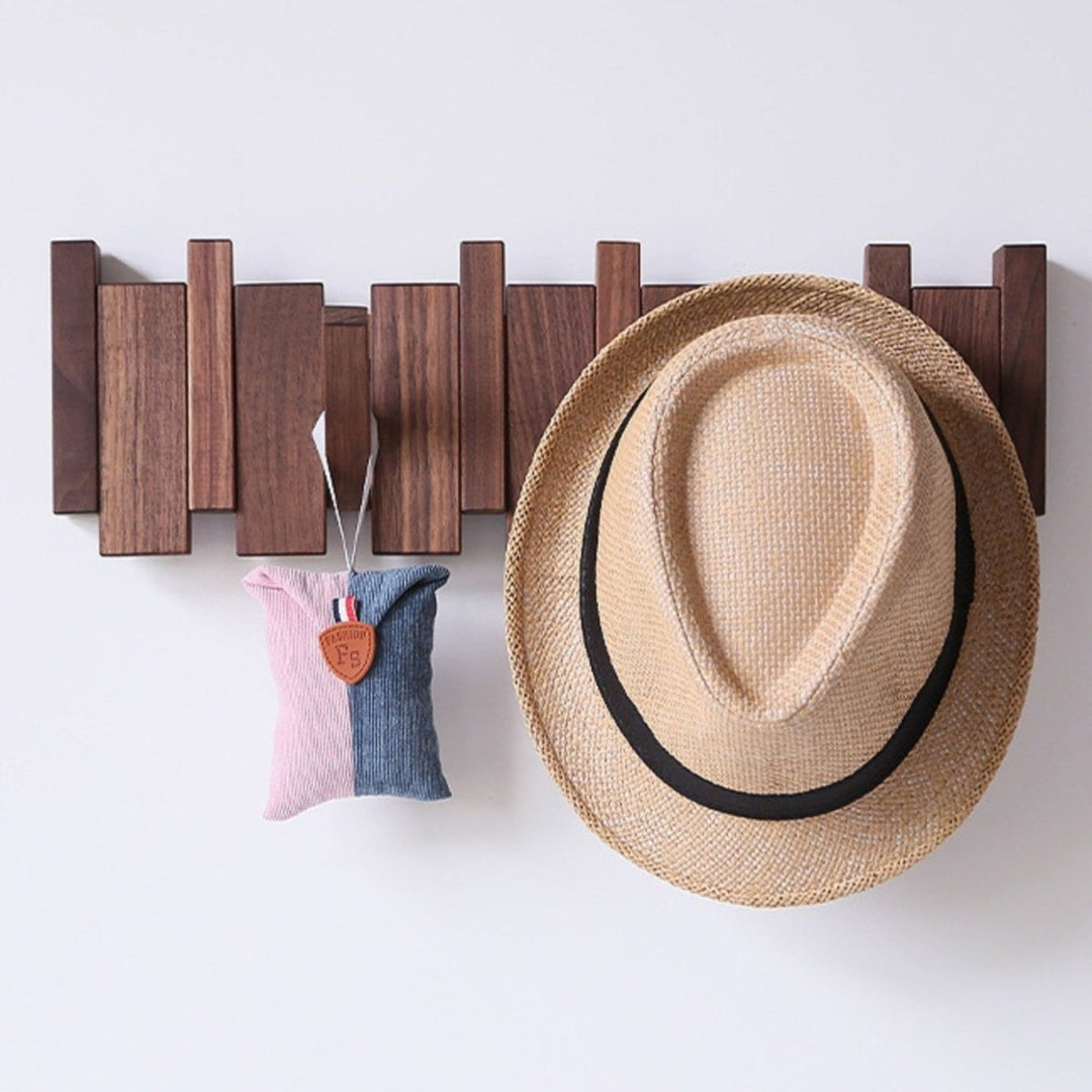 "Elegant handmade wooden piano coatrack front view, showcasing unique piano key design and quality craftsmanship in home deco