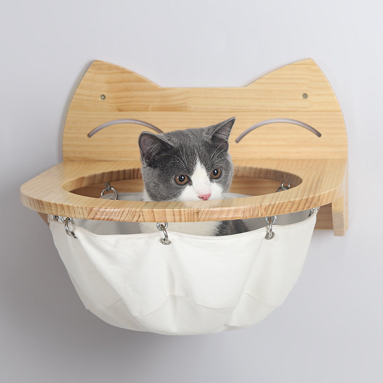 "Elegant hanging wooden cat basket, elevated perch, modern home décor, stylish pet supplies, cozy wooden hammock."