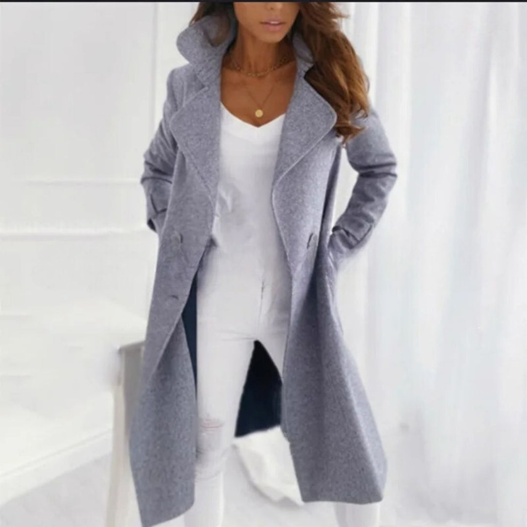 Classic women's long coat, elegant outerwear with turned-down collar, a stylish jacket for winter fashion.