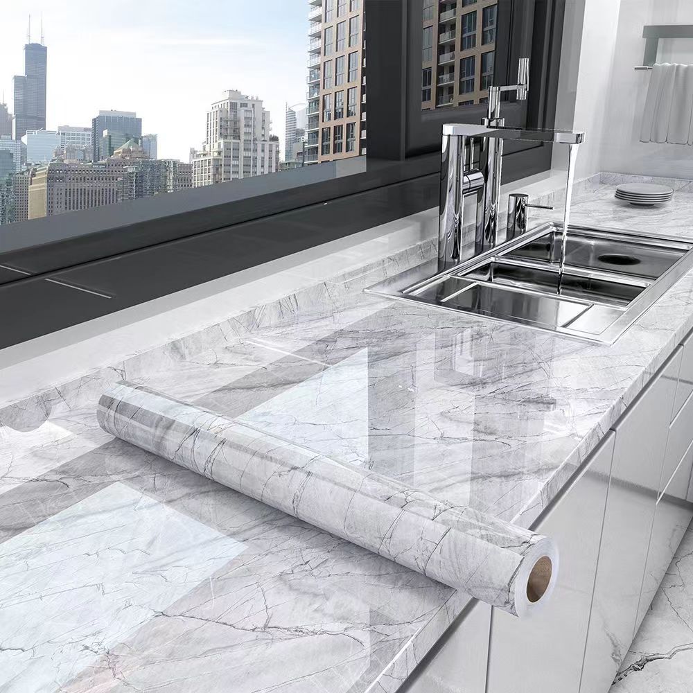 Oil-resistant self-adhesive marble film for kitchen, waterproof contact paper protects countertops & walls.