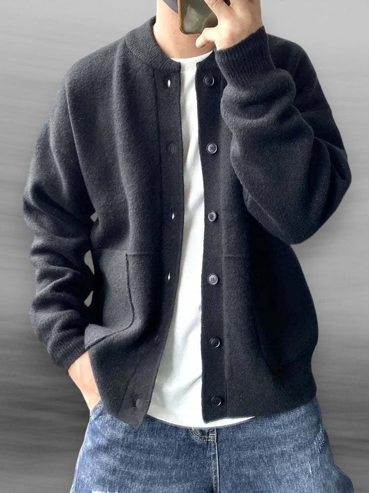 Elegant men's knitted cardigan in beige, showcasing ribbed cuffs and hem, perfect for casual or semi-formal wear.