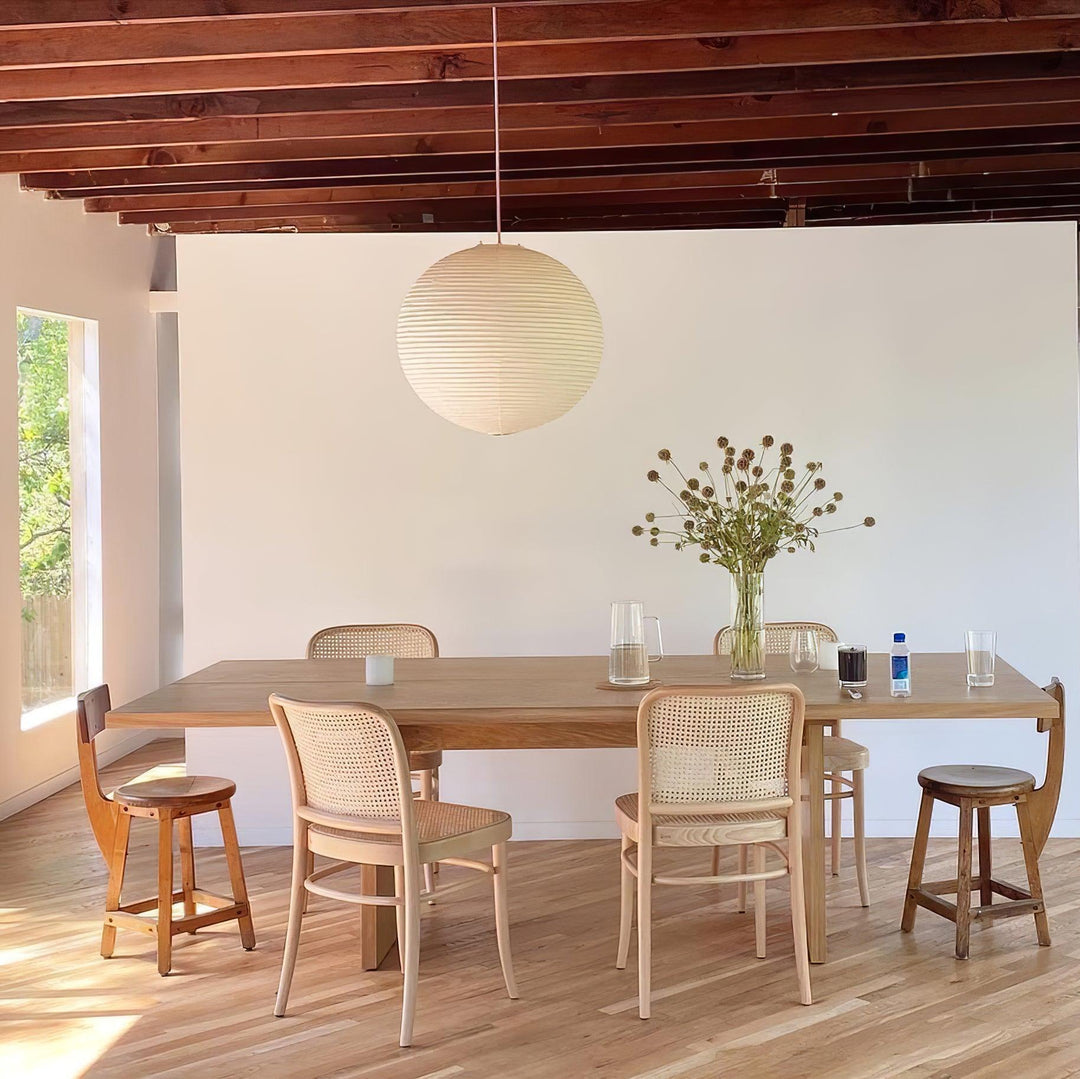 "Elegant modern Japanese paper lantern pendant light with a warm glow, blending contemporary and mid-century design."