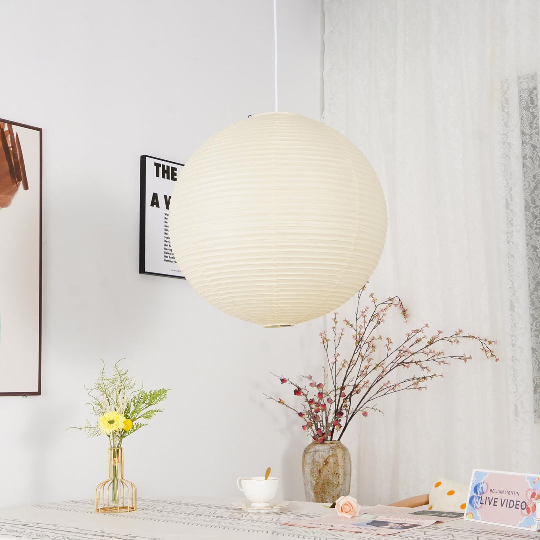 "Elegant modern Japanese paper lantern pendant light with a warm glow, blending contemporary and mid-century design."