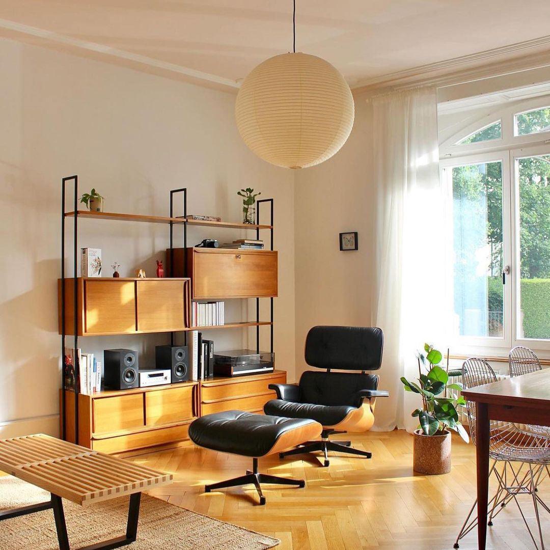 "Elegant modern Japanese paper lantern pendant light with a warm glow, blending contemporary and mid-century design."