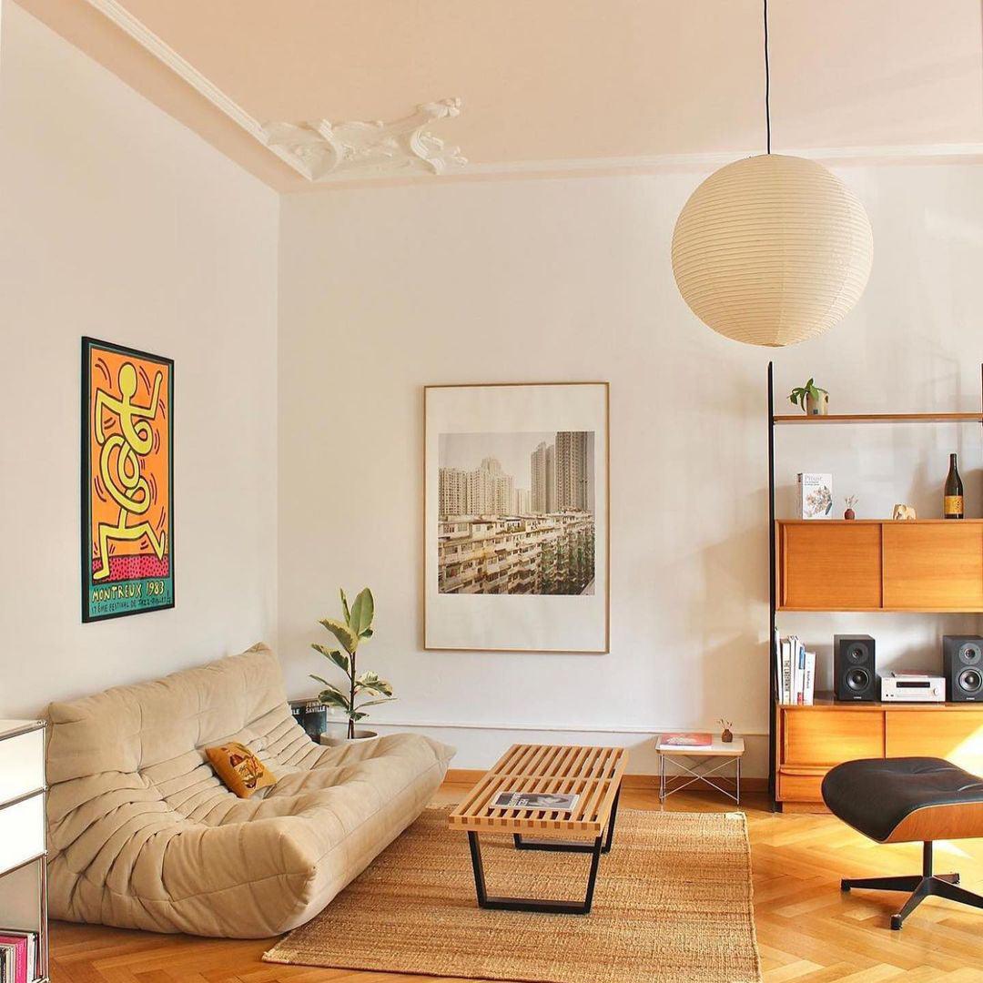 "Elegant modern Japanese paper lantern pendant light with a warm glow, blending contemporary and mid-century design."