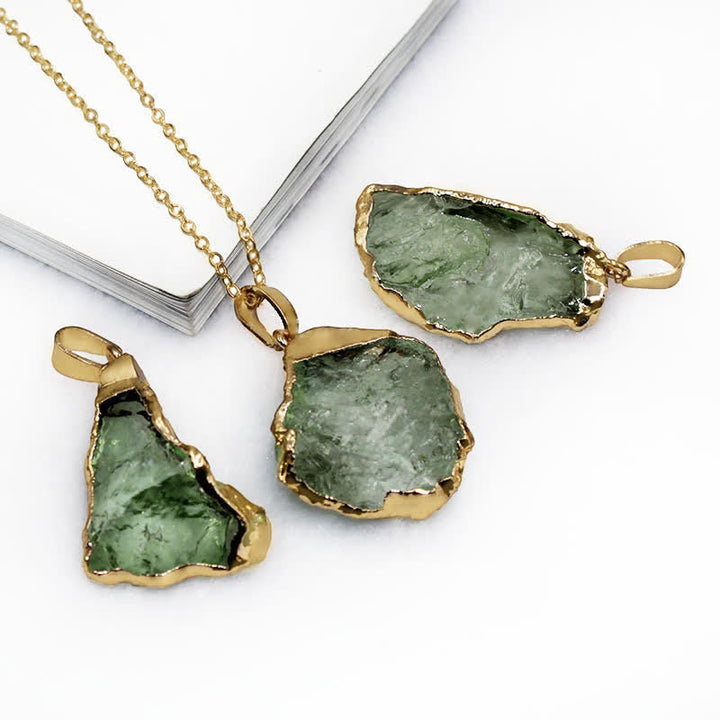 Elegant Moldavite necklace with unique design, featuring a green gemstone. Perfect for adding sophistication to any outfit.
