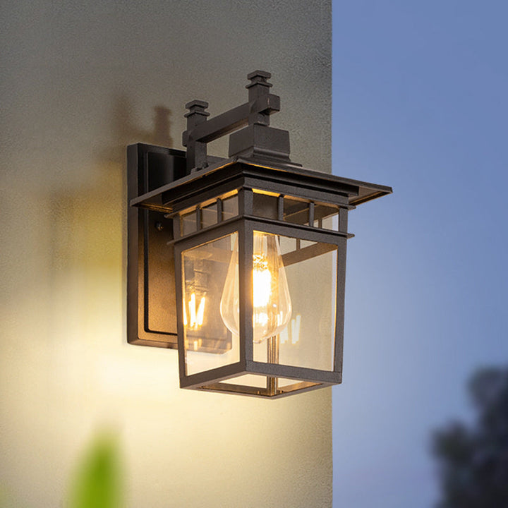 "Elegant outdoor waterproof lantern wall light with black finish and glass shade, perfect for gardens and porches."