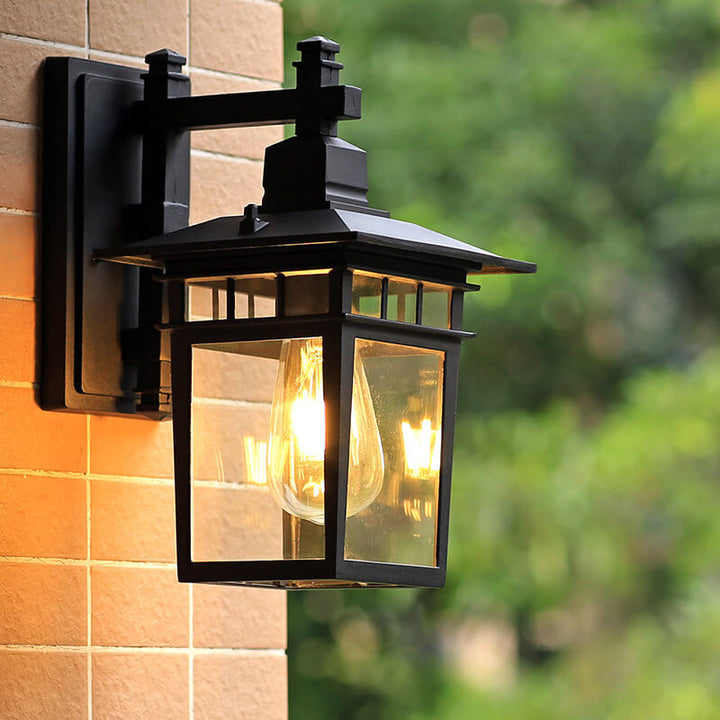 "Elegant outdoor waterproof lantern wall light with black finish and glass shade, perfect for gardens and porches."
