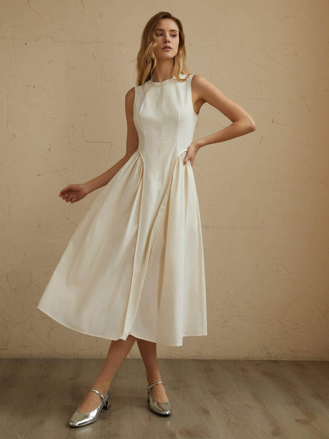 Elegant pleated midi dress for women, flowing & comfortable. Perfect for formal or casual events. Off-white/black options.