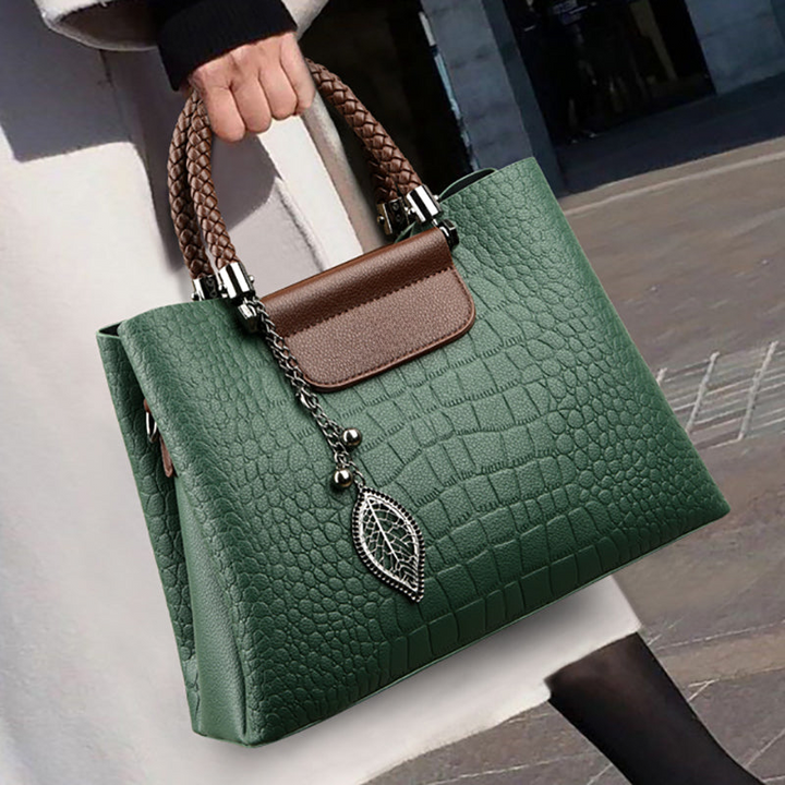 Elegant teak women's handbag with luxe design, showcasing premium craftsmanship and spacious interior in classic colors.