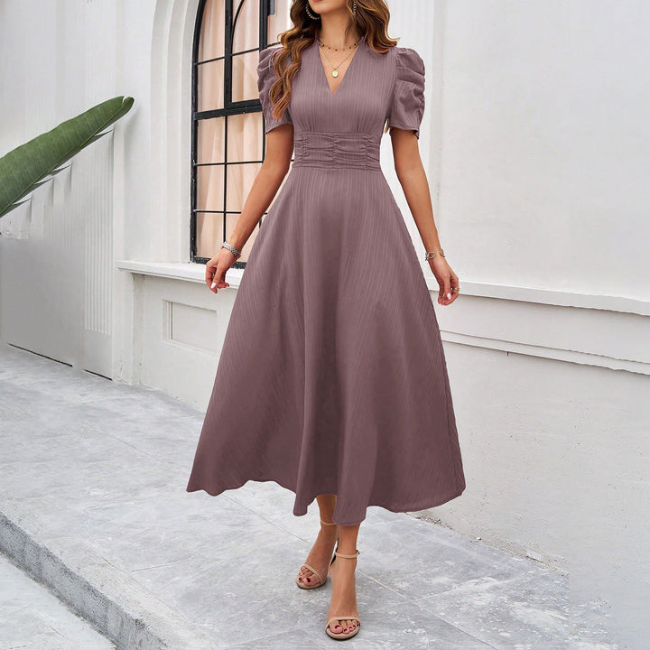 Casual yet elegant V-neck midi dress for women, with comfortable cotton blend and puff sleeves. Great for spring/summer wear.