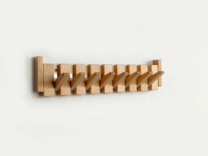 Innovative piano-style wood coat rack. Wall-mounted organizer enhances entryway decor and provides storage.