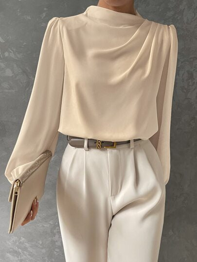 Cuff detail of a women's bishop sleeve blouse. Elegant long sleeve design, perfect for stylish business casual apparel.